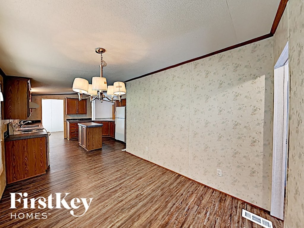 a view of the kitchen and living room from the dining room