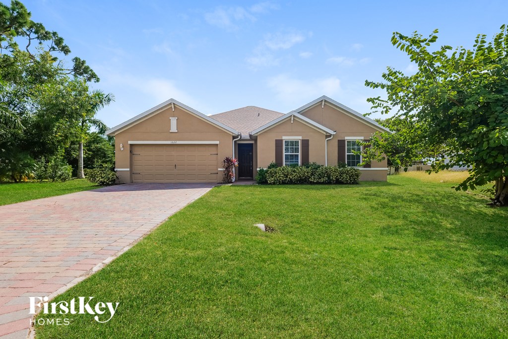 A house with a garage is for sale by FirstKey Homes.