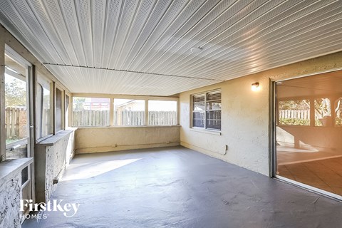 the living room of an empty house with a patio