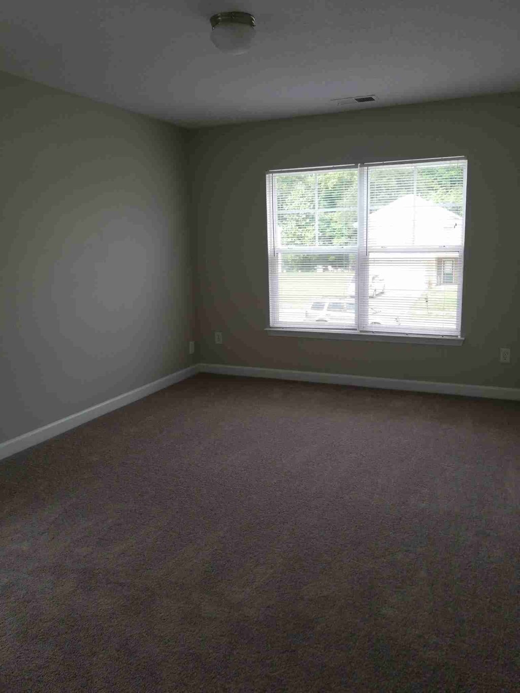 an empty room with a window in it
