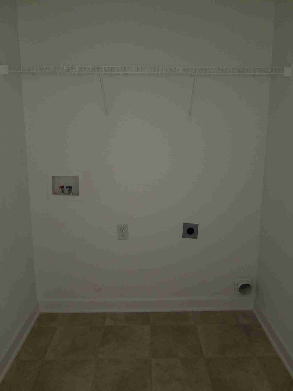 a room with a wall with two electrical outlets