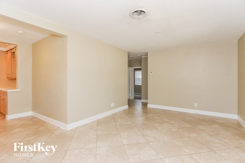the living room and dining room are empty and ready to be remodeled