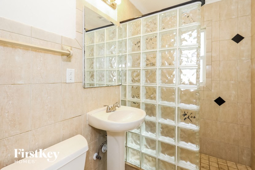 a small bathroom with a sink and a mirror