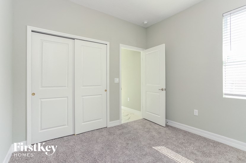 A room with two doors and a window.