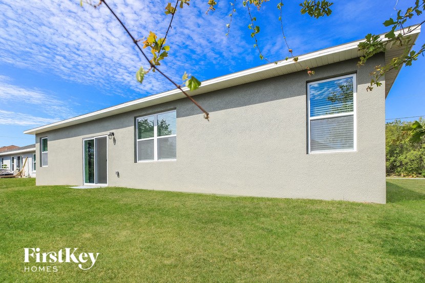 A house with a lawn in front of it.