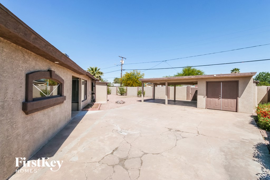an empty parking lot in front of a building