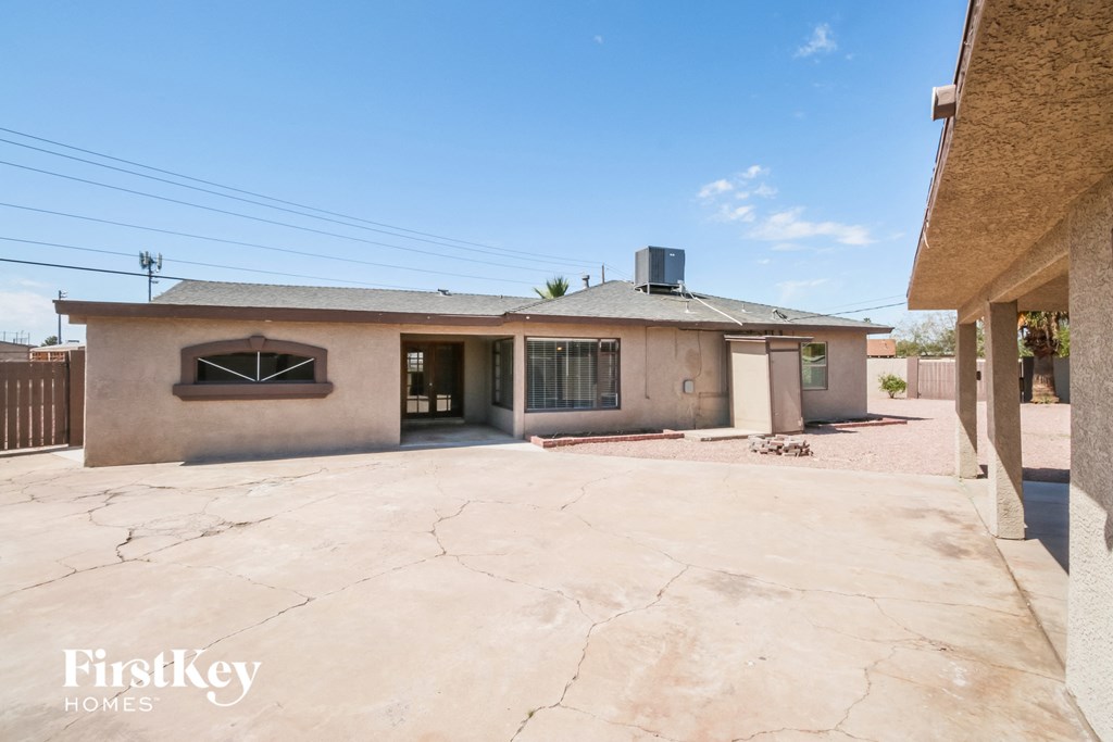 an empty driveway in front of a house