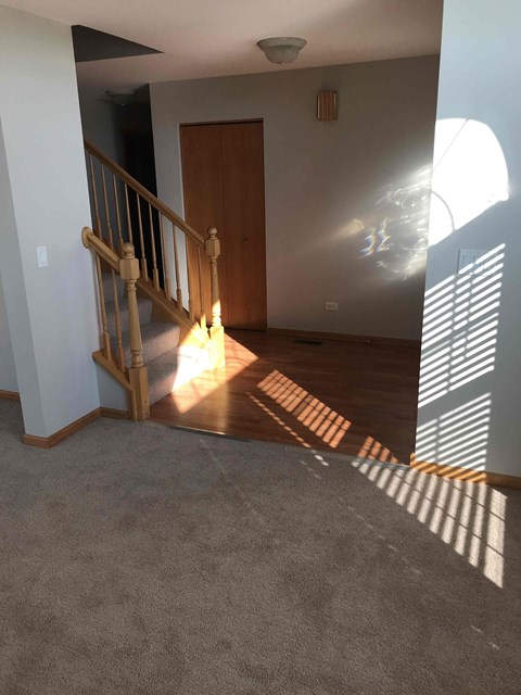 a view of a stairway in a house with wood floors
