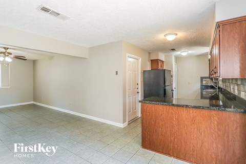 a kitchen with a counter top and a refrigerator