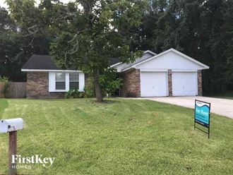 a house with a foreclosure sign in front of it