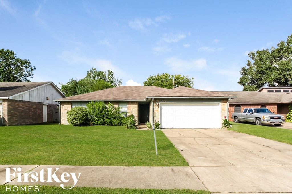 a house with a driveway and a garage door