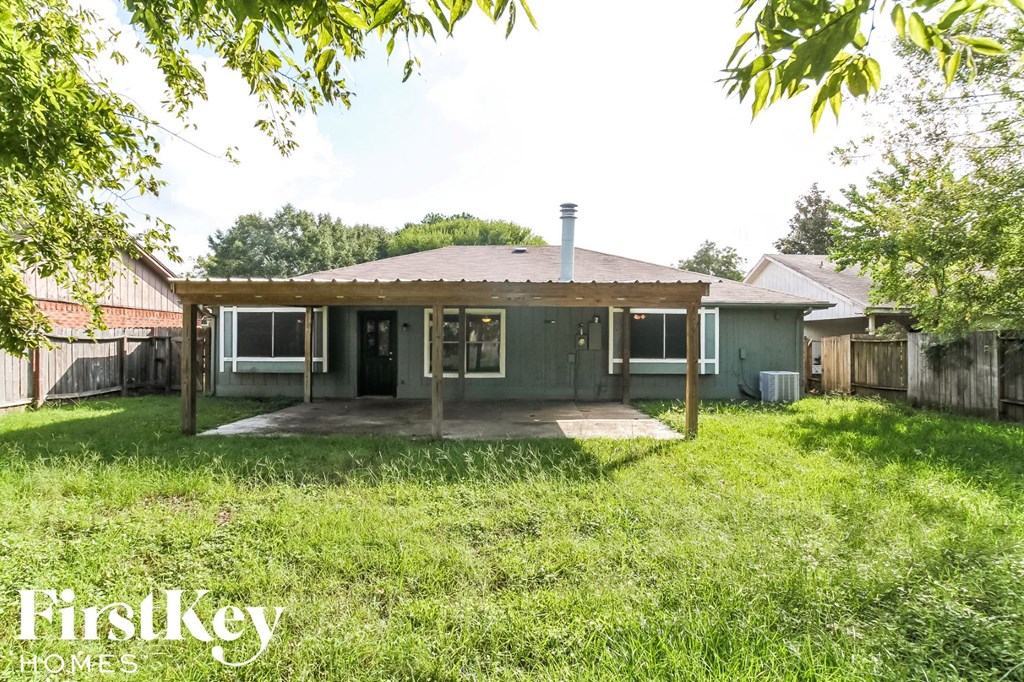 a home with a covered porch in a grassy yard