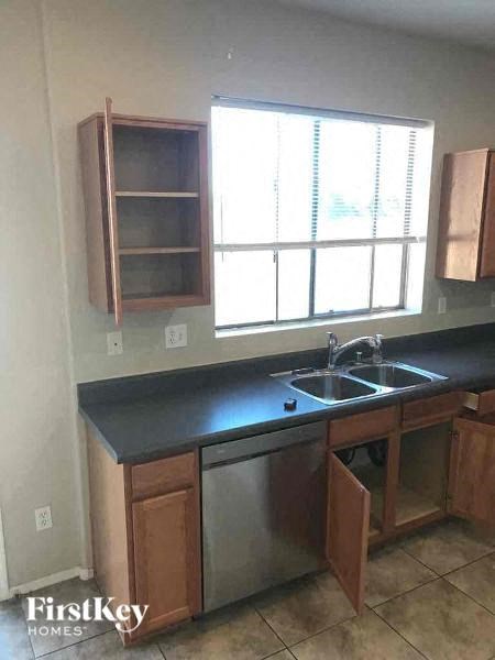 a kitchen with a sink and a window