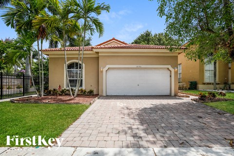 a home with a driveway and a garage door