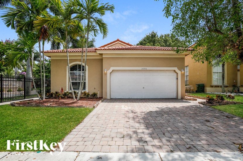 a home with a driveway and a garage door