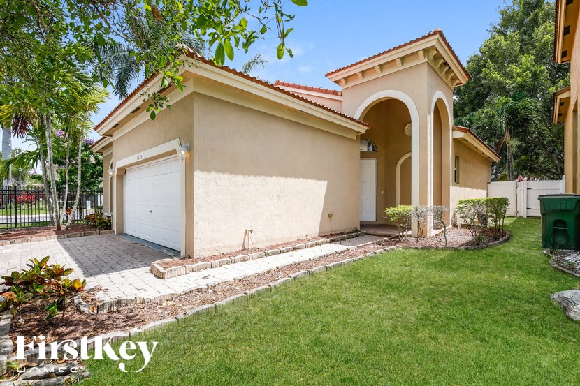 a house with a driveway and a garage door