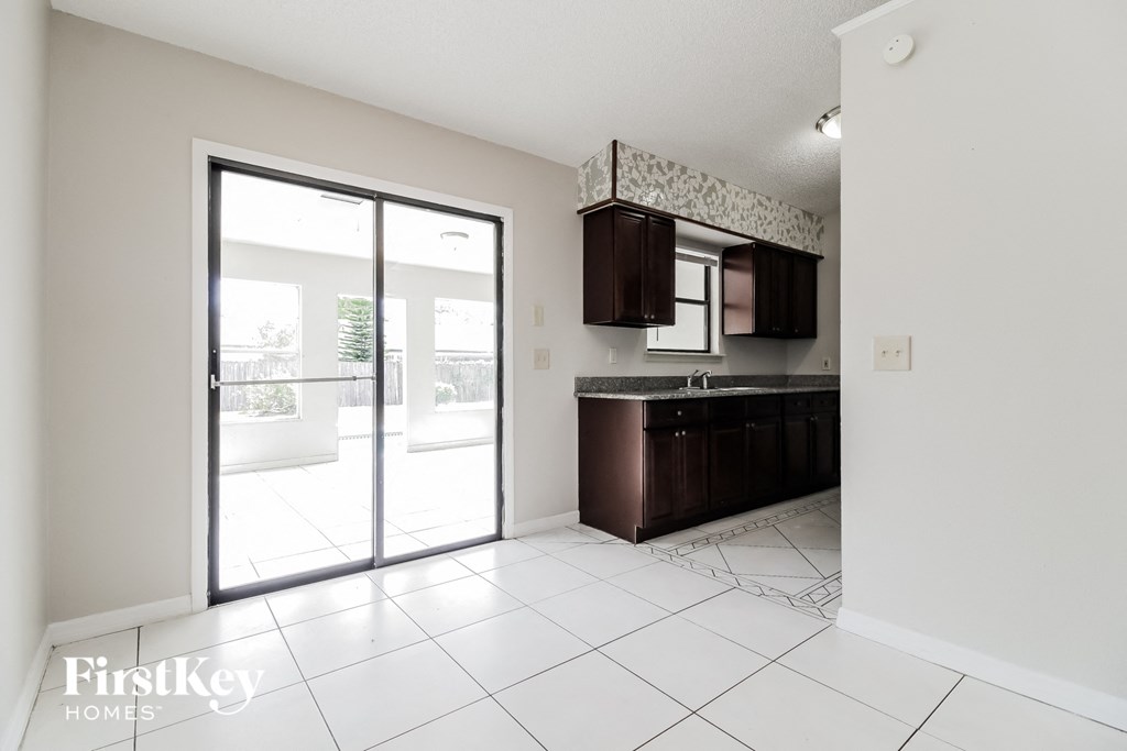 A kitchen area with a counter and cabinets.