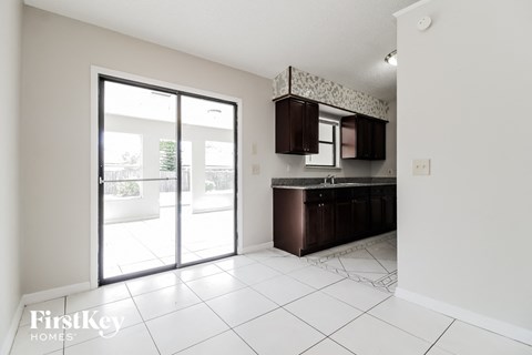 A kitchen area with a counter and cabinets.