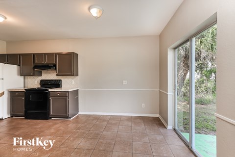 A kitchen area with a black oven and stove top is shown.