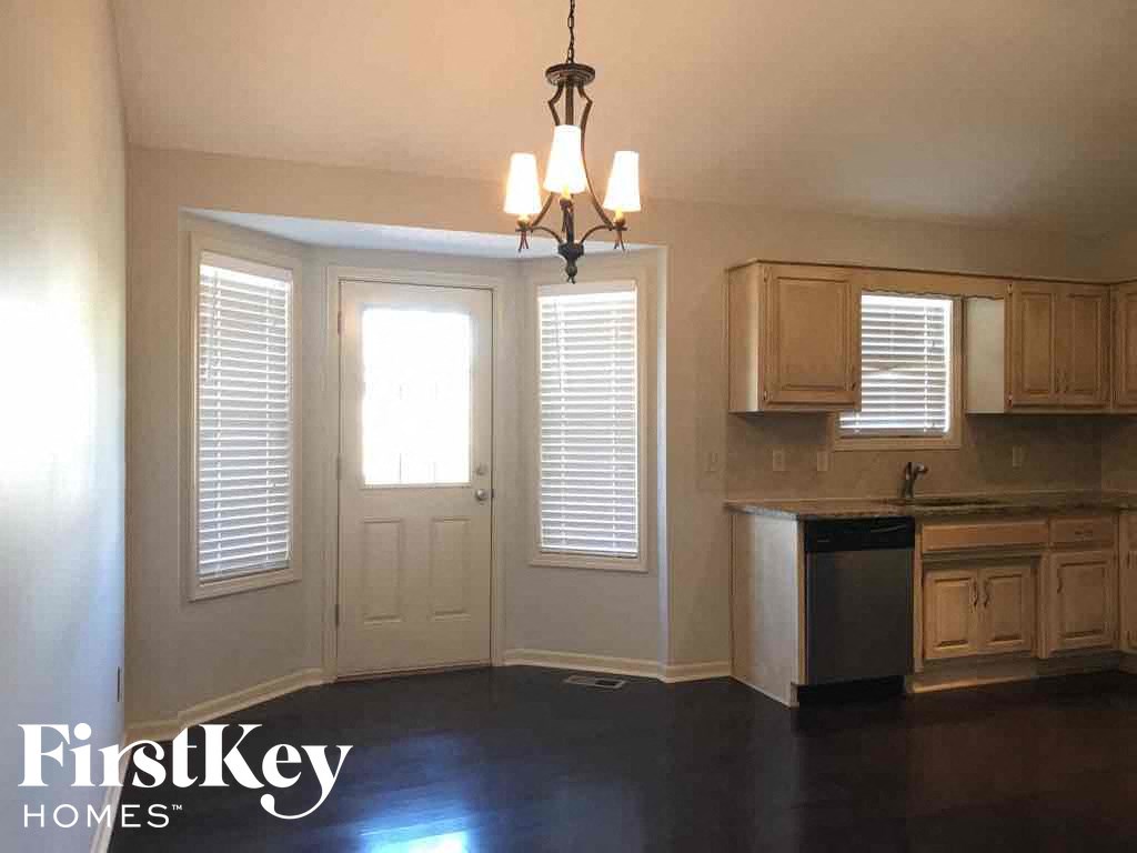 A kitchen with a FirstKey Homes logo.