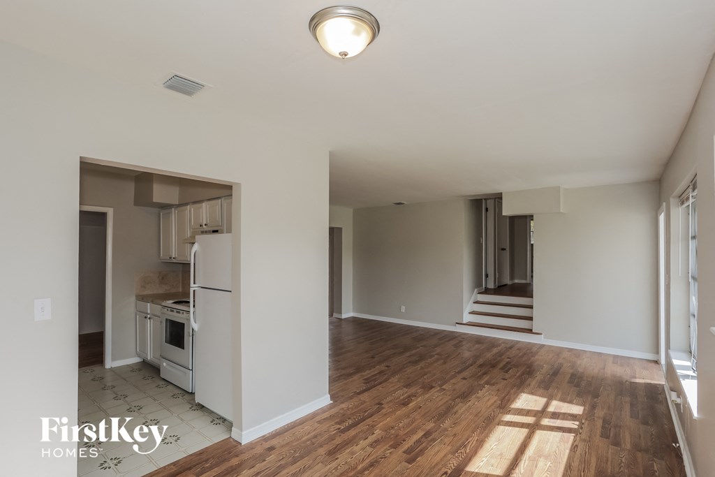 a renovated living room and kitchen in a new home