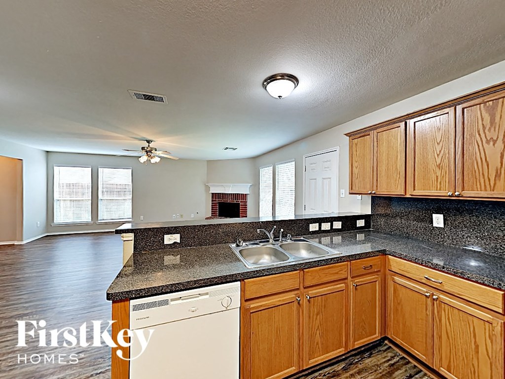 a kitchen with a counter top and a sink