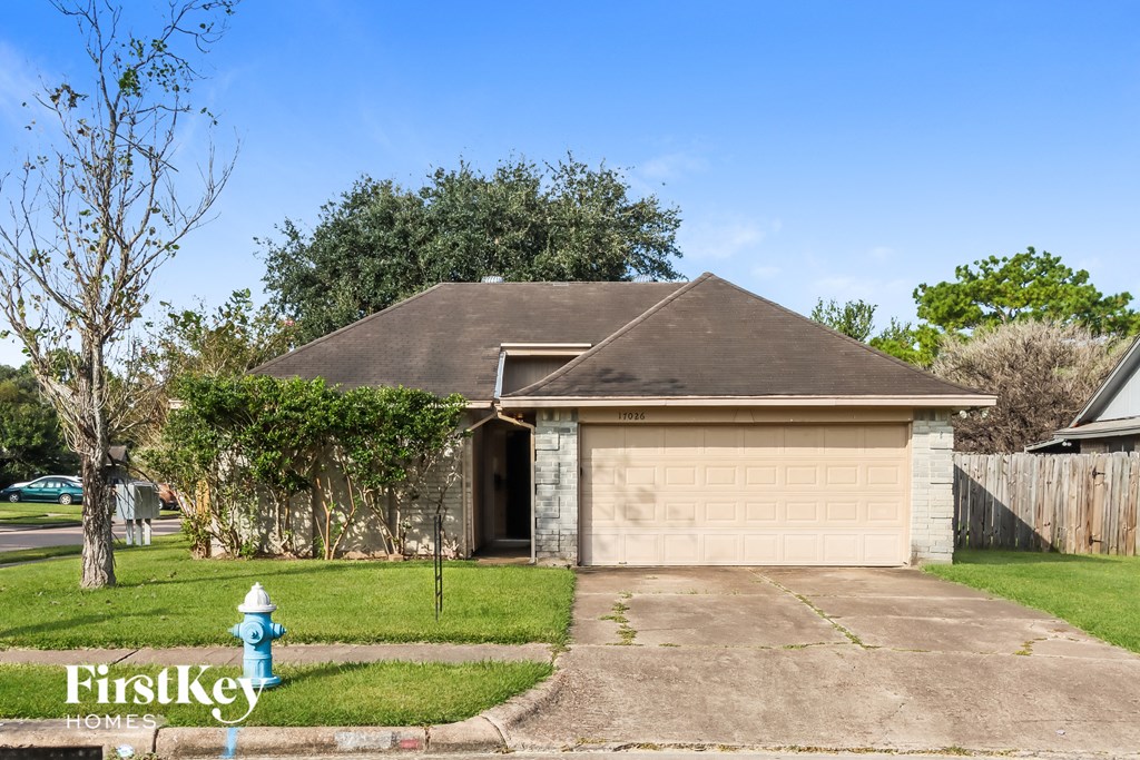 the front of a garage with a blue fire hydrant