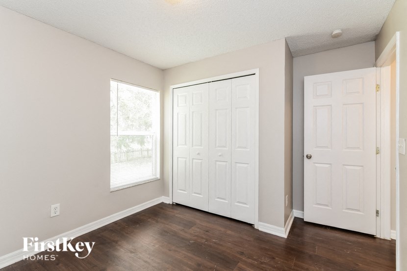 the living room is clean and ready to be used as a home office