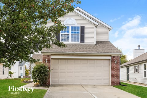 A house with a garage is for sale by FirstKey Homes.
