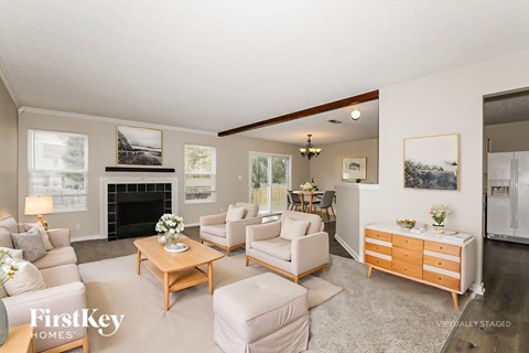 A living room with a fireplace and a couch.