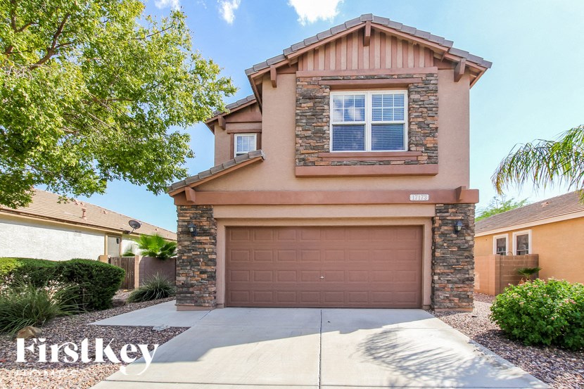 A house with a brown garage door is for sale.