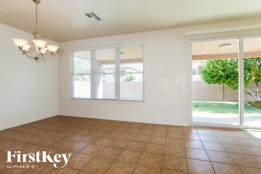 A room with a tiled floor and a chandelier.