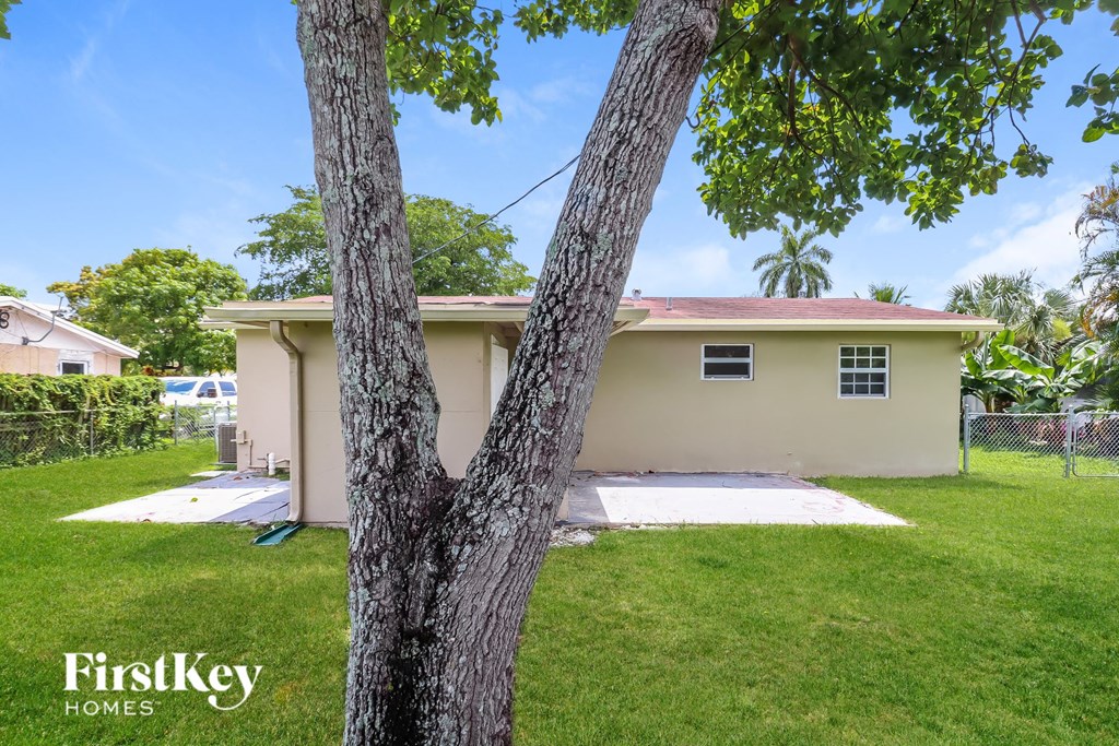 a house with a tree in front of it