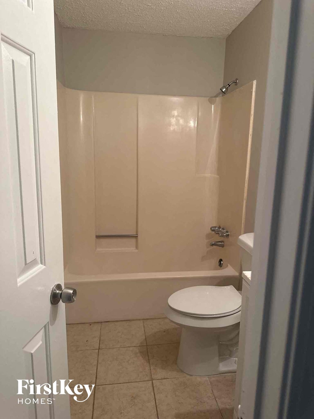 a small bathroom with a toilet and a shower