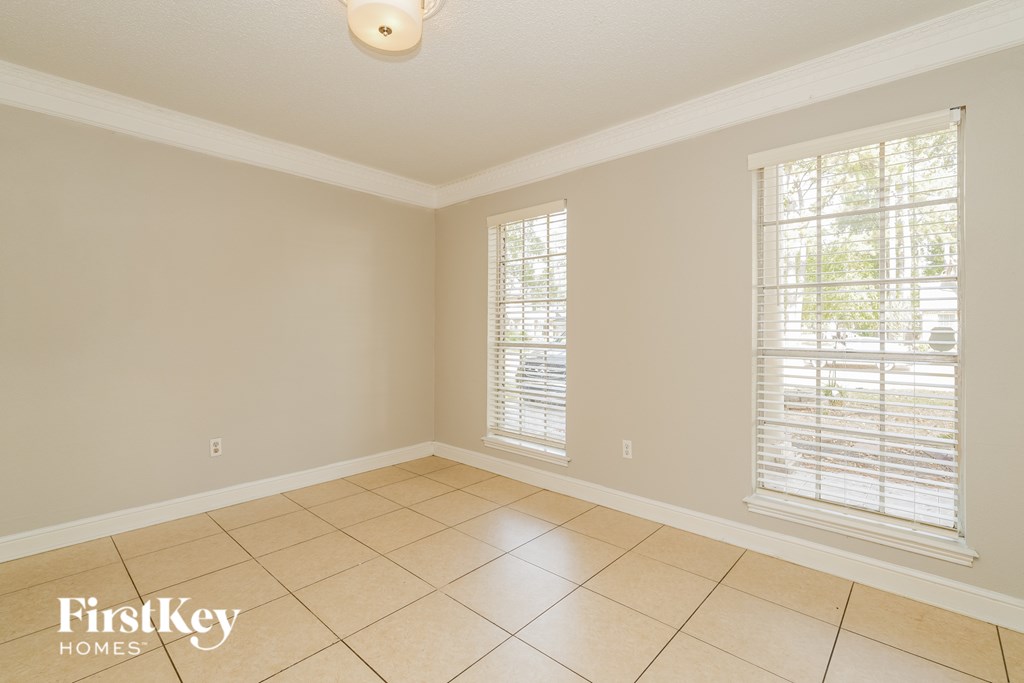 A room with a FirstKey Homes logo on the floor.