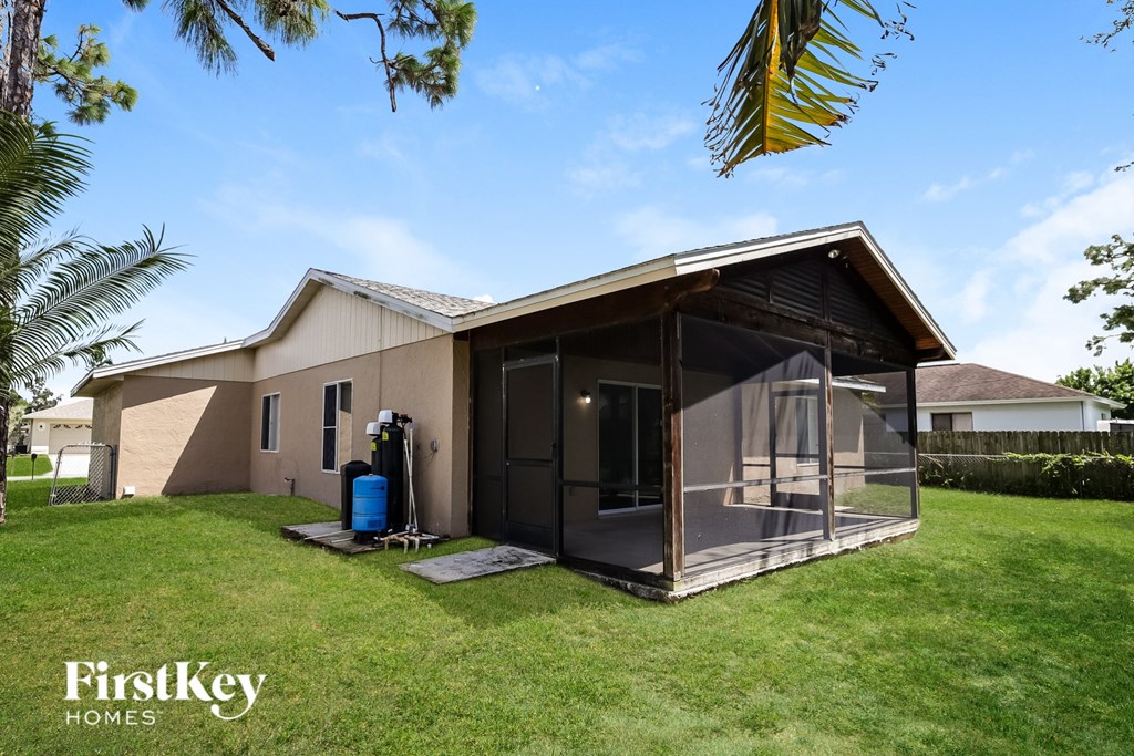 A house with a glass wall extension is for sale by FirstKey Homes.