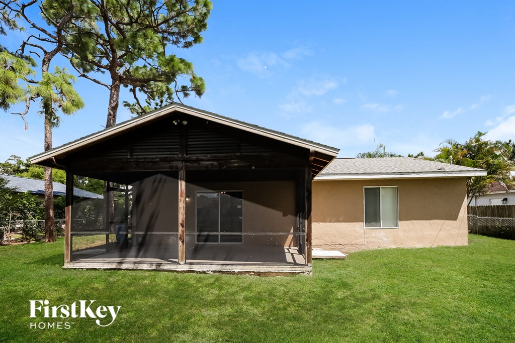 A house with a covered patio is for sale by FirstKey Homes.