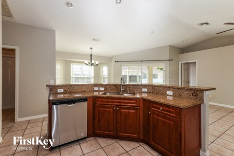 a kitchen with a stainless steel dishwasher and a counter top