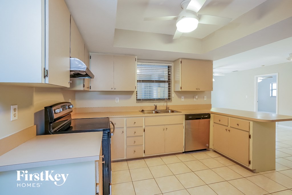A kitchen with a FirstKey Homes logo on the bottom left.