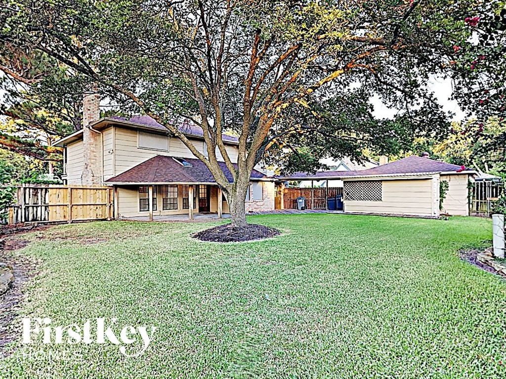 a house with a yard and a tree