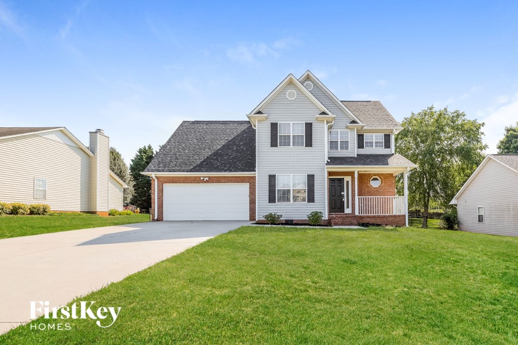 A large house with a garage is for sale.