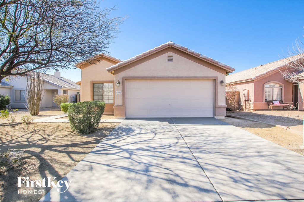A house with a garage is for sale by FirstKey Homes.