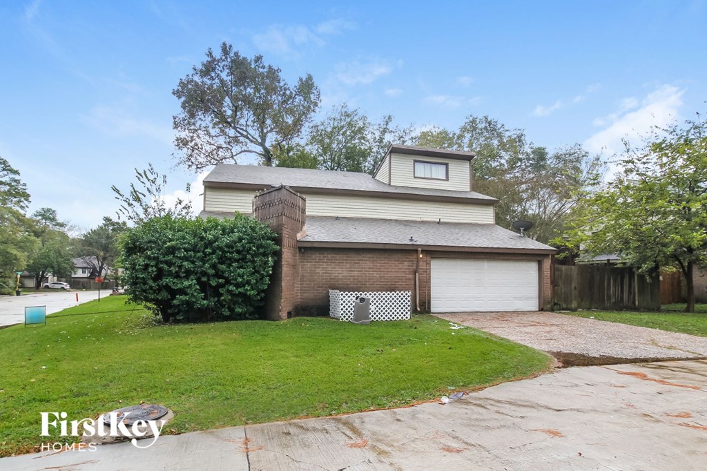 A house with a garage is for sale.