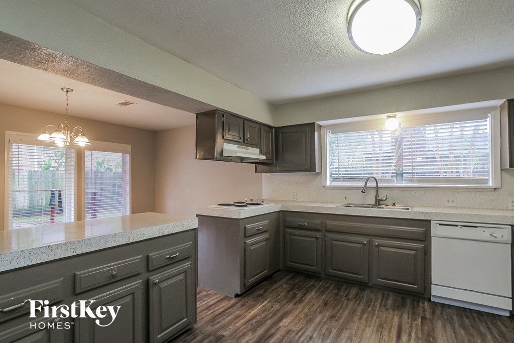 A kitchen with a FirstKey Homes logo on the counter.