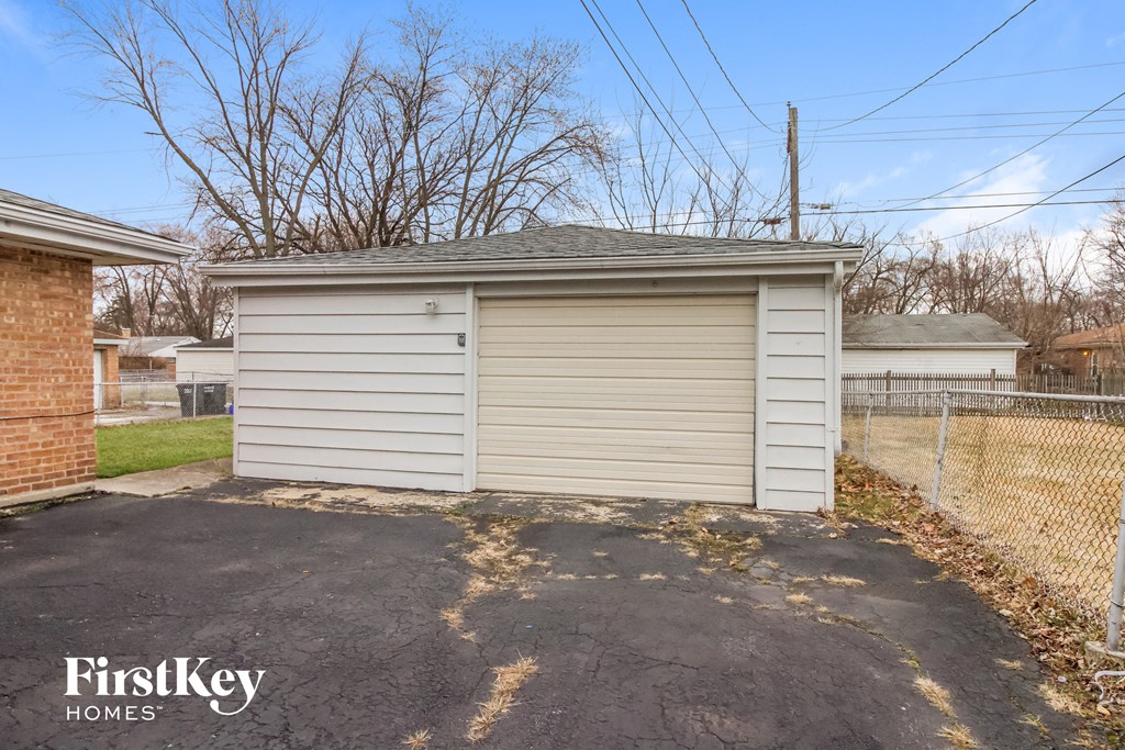 A garage with a FirstKey Homes logo.