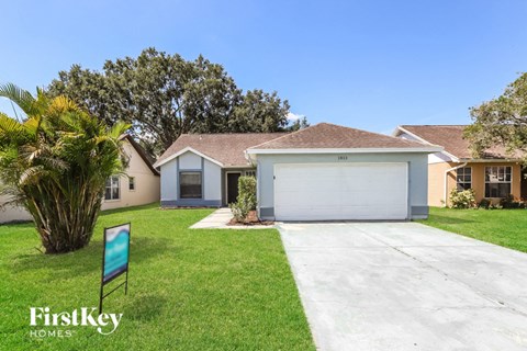 a house with a driveway and a garage door