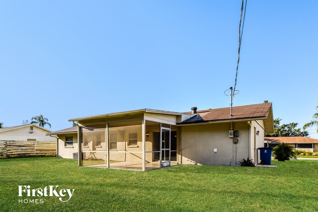A house with a sign that says "FirstKey Homes" in front of it.