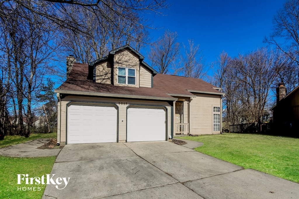 A two-car garage is attached to a house.