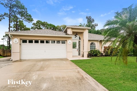 a house with a driveway and a garage door