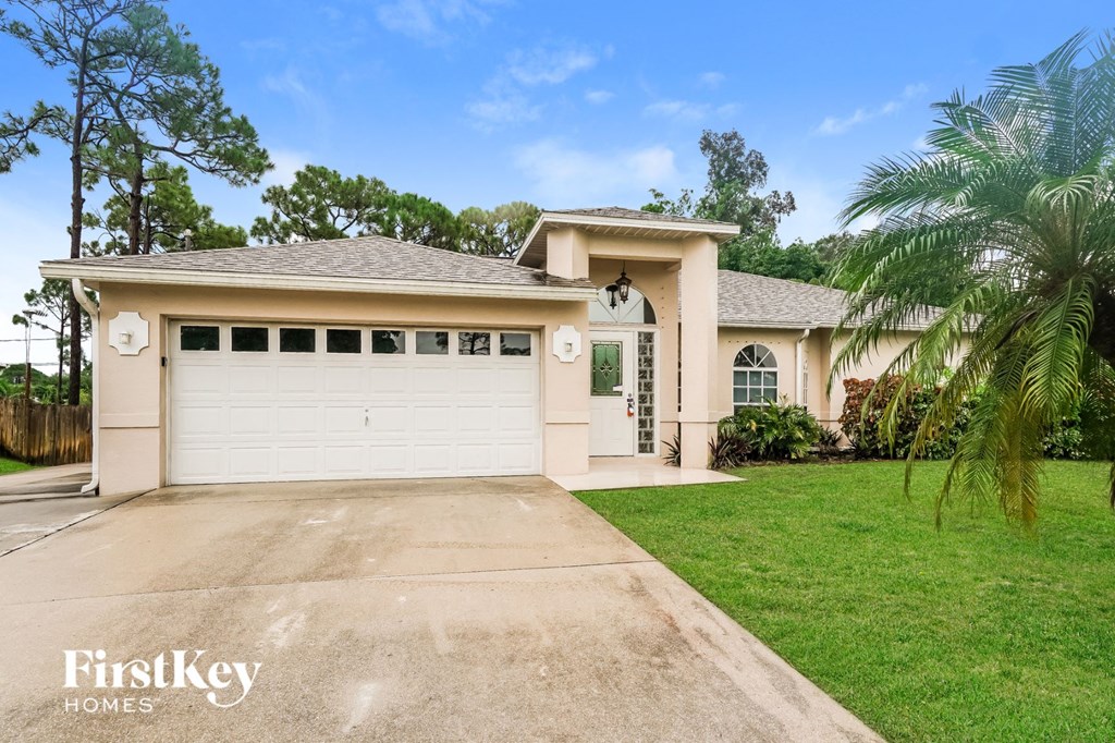 a house with a driveway and a garage door